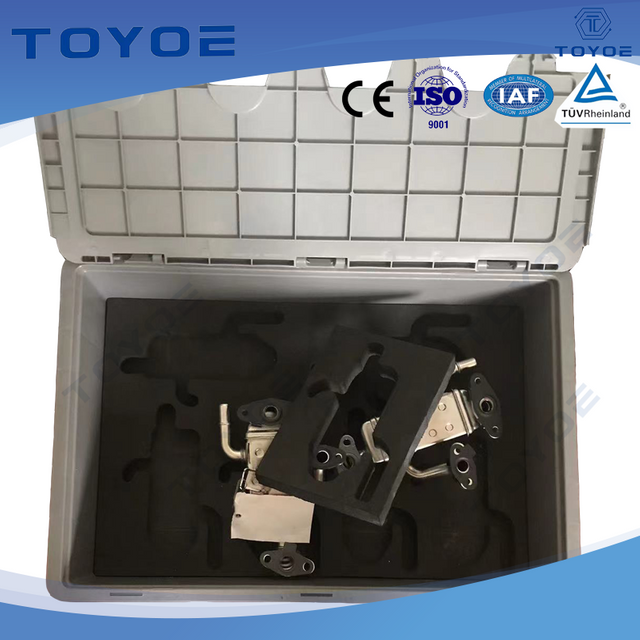 Lidded plastic box with foam-lined interior securely holds small car parts.