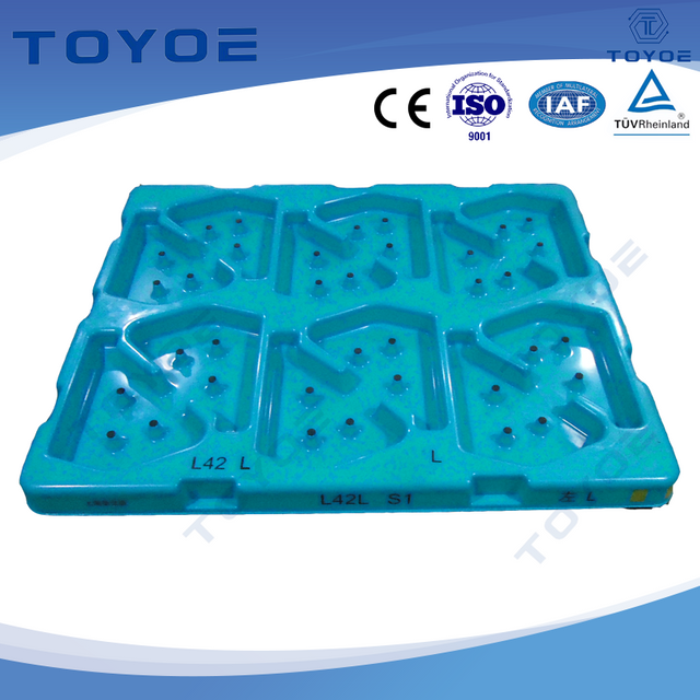 Molded plastic pallets fit a variety of auto parts for transport.